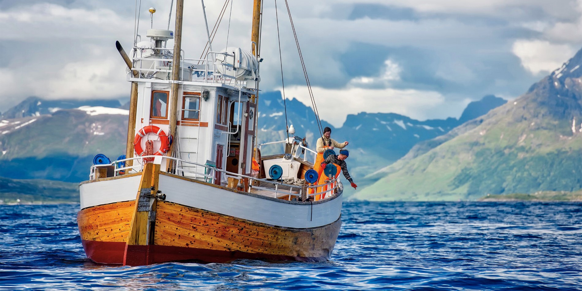 A fishing boat with two fisher men in Northern Norway