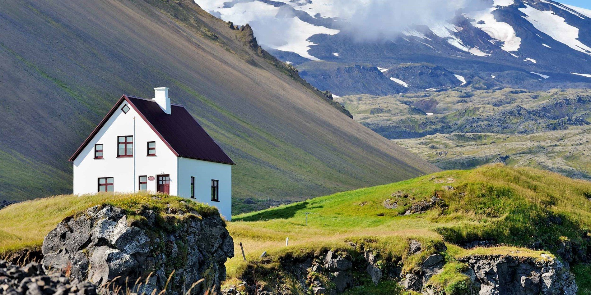 A house with a mountain in the background