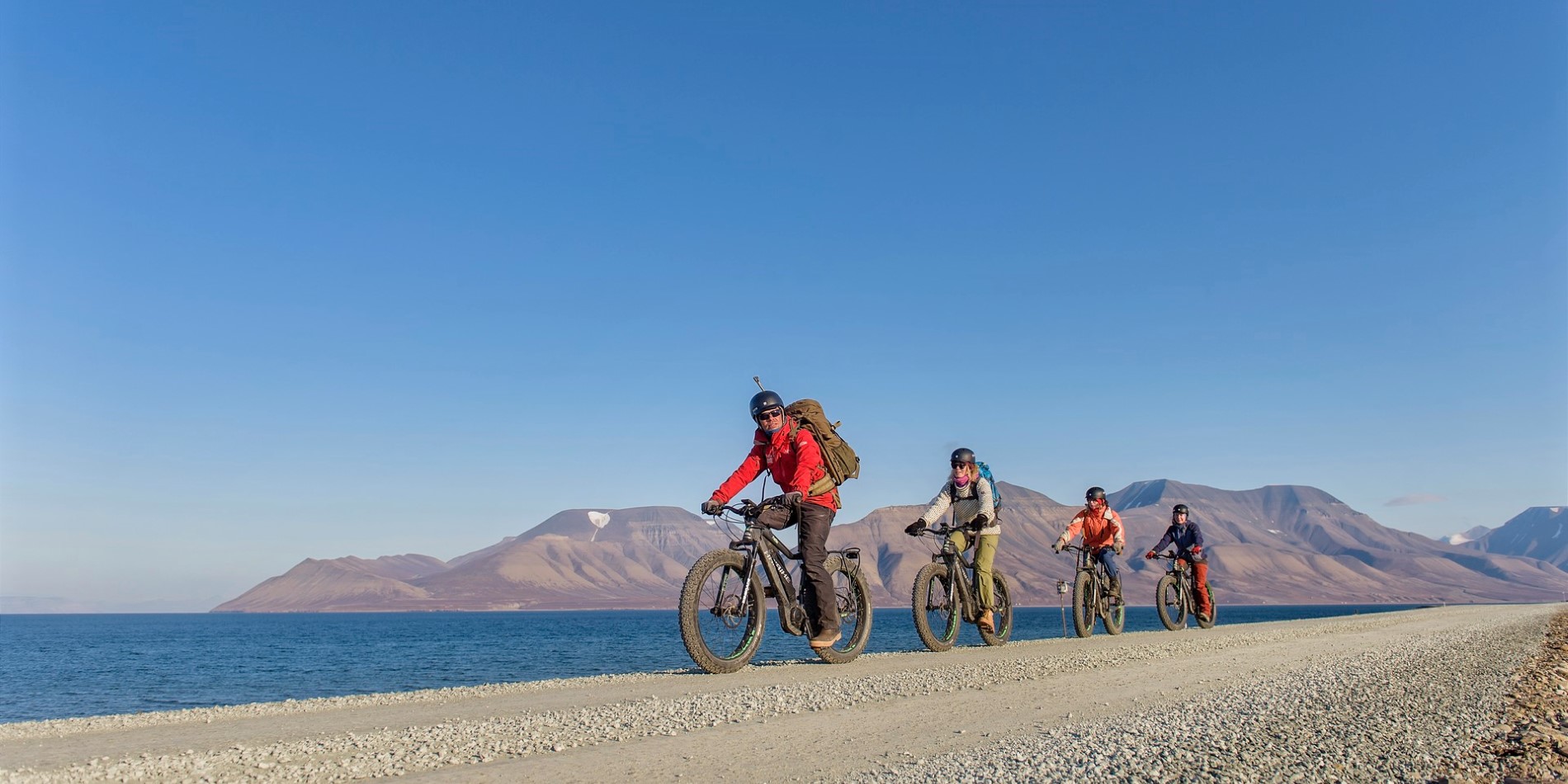 Get equipped with helmets and electric bikes and start a sightseeing trip around Longyearbyen
