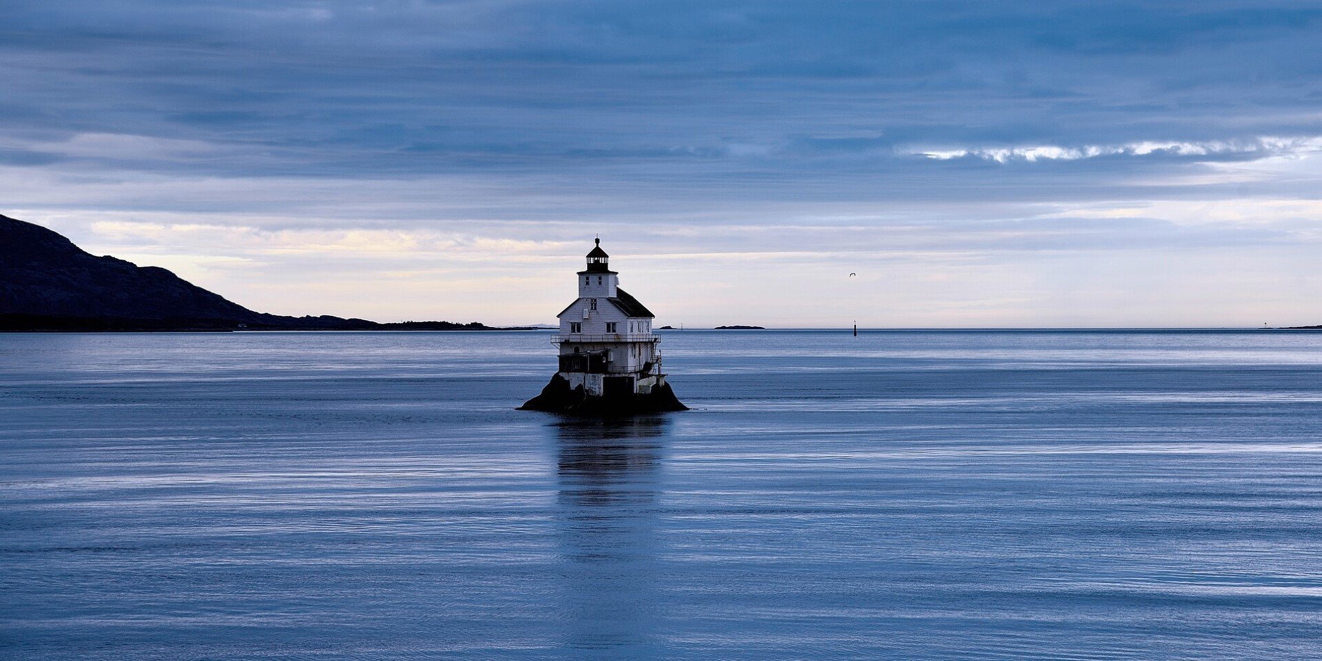 Dusk over Stabben Lighthouse just outside the port of Florø in Norway