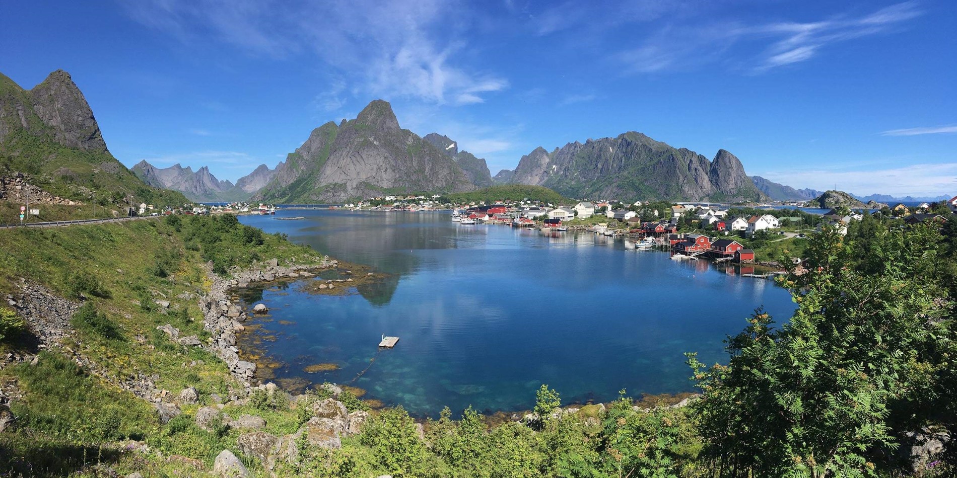 An island in the middle of Lofoten surrounded by a body of water